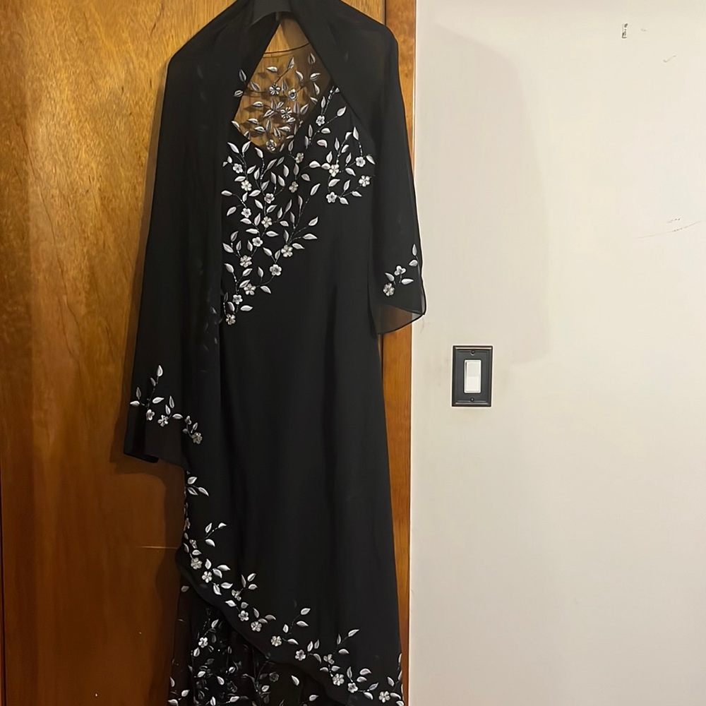 This dress is black with grey leaves very nice dress to wear for a wedding